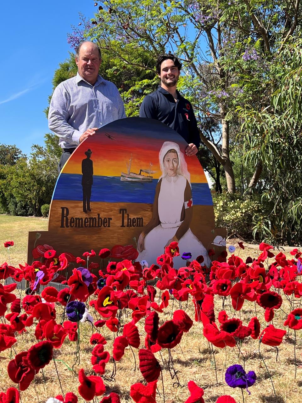 Shire of Dardanup President Tyrrell Gardiner (right) and Place and Community Officer Will Tuck at one of the colourful Poppy Project art trails in Eaton, which is a visual tribute to this year’s Remembrance Day.